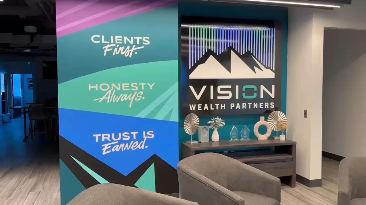 Vision Wealth Partners office with branded graphics printed on PriWatt smart glass